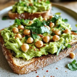 - 1 can (15 oz) chickpeas, rinsed and drained - 1 ripe avocado - 4 slices of whole grain bread Chickpeas are the star of this dish. They add protein and fiber. Avocado brings creaminess and healthy fats. Whole grain bread serves as a sturdy base, making each bite satisfying. - 1 small garlic clove, finely minced - 1 tablespoon freshly squeezed lemon juice - 1 tablespoon tahini Garlic adds a tasty kick to the mix. Lemon juice brightens the flavors, making the toast fresh. Tahini gives a nutty flavor and creaminess, which balances the dish well. - 1/2 teaspoon ground cumin - Salt and freshly cracked black pepper to taste - Fresh cilantro or parsley, chopped, for garnishing - Red pepper flakes, for a touch of heat (optional) Ground cumin adds warmth. Salt and pepper enhance all the flavors. Fresh herbs give color and a burst of taste. If you like spice, red pepper flakes can be an exciting addition. This recipe is a wonderful mix of flavors and textures. You can find the full recipe above to create your own tasty meal! Start by rinsing the chickpeas. Use a fine mesh strainer to drain them well. This step is key to removing excess salt and preserving the flavor. Next, place the chickpeas in a medium mixing bowl. Now, mash them with a fork or potato masher. Aim for a slightly chunky texture. You want some whole chickpeas for added bite. Now, let’s work on the avocado. Cut the ripe avocado in half and remove the pit. Scoop the flesh into the bowl with the chickpeas. Gently combine the avocado and chickpeas. Mash them together until you reach your desired texture, whether creamy or a bit chunky. Next, add the minced garlic, lemon juice, tahini, and ground cumin. Stir everything together well. This mix brings out great flavors. Season with salt and freshly cracked black pepper to taste. If you like a kick, add red pepper flakes and mix again. It’s time to toast the bread. Preheat your toaster or a skillet over medium heat. Toast the slices until they are golden and crispy. This part is crucial for the perfect crunch. Once the bread is toasted, spread a generous amount of the chickpea and avocado mix on each slice. Make sure every bite is delicious. Drizzle a little olive oil on top for extra flavor. Finally, garnish with chopped cilantro or parsley. This adds a lovely burst of color and freshness to your meal. For the full recipe, check out the section above. For the best chickpea avocado smash, you need to think about texture. Do you want it chunky or creamy? I prefer a mix of both. You can mash the chickpeas until they are mostly broken down but leave some whole. This gives a nice bite. When you mix in the avocado, mash it lightly. This way, you keep some chunks for a tasty contrast. Choosing the right bread is key for this dish. Whole grain bread works well, but you can also try sourdough or rye. Each bread adds a unique taste. For a crunchy texture, toast the bread until it's golden brown. You can use a toaster or a skillet. If you use a skillet, add a drizzle of olive oil for extra crispiness. Want to spice things up? Try adding a pinch of paprika or cayenne pepper. You can also top your toast with sliced radishes or cherry tomatoes for added freshness. Pair it with a light salad or some fresh fruit for a perfect meal. This dish pairs well with a simple green salad, making it a full meal. You can check the Full Recipe for more ideas! {{image_4}} You can easily modify this recipe to fit your diet. For those who follow a vegan diet, this toast is already perfect as it uses no animal products. You can enjoy the creamy avocado and chickpeas without worry. If you need a gluten-free option, simply switch to gluten-free bread. Many brands offer tasty gluten-free choices that hold up well with the chickpea avocado mixture. To jazz up your toast, try adding fresh herbs like cilantro or basil. They bring bright flavors that make each bite exciting. You can also mix in roasted veggies. Think bell peppers or zucchini. They add texture and nutrients to your meal. Just chop the veggies, roast them until golden, and fold them into your chickpea avocado mix. This dish works great for breakfast or as a snack. You can serve it with a side of fresh fruit or yogurt for a balanced meal. For a fun twist, try serving the toast on a wooden board. Drizzle olive oil around the edges. This adds a nice touch and makes your dish look fancy. You can even sprinkle some red pepper flakes for a little heat. When you present it this way, your guests will think you're a gourmet chef! For the full recipe, check out the details above and get started on this delicious treat. To keep your Chickpea Avocado Smash Toast fresh, store any leftovers in airtight containers. This helps prevent air from drying it out. I recommend using glass containers, as they are sturdy and safe for food. Avoid plastic wrap, as it may not seal as well. Your Chickpea Avocado Smash can last about 2 days in the fridge. To keep it fresh, cover the mixture tightly. The avocado can brown over time, so it's best to eat it sooner rather than later. If you notice browning, a quick stir can mix it back in. When reheating, use low heat to maintain texture. You can warm the toast in a skillet for a few minutes. This helps keep the bread crispy. Avoid the microwave, as it can make the toast soggy. For best results, serve right after making. If you want, you can add fresh herbs or a drizzle of olive oil when reheating to boost flavor. You can add protein-rich foods. Here are some great options: - Hard-boiled eggs - Feta cheese - Greek yogurt - Grilled chicken These additions will make your toast more hearty. Each option pairs well with the creamy smash. Yes, you can! Store the mixture in an airtight container. - Keep it in the fridge. - Use it within two days for the best taste. Adding lemon juice helps the mix stay fresh longer. This way, you can enjoy quick meals. Chickpeas are high in protein and fiber. They help keep you full and healthy. Avocados are packed with healthy fats. They are good for your heart. Together, they provide: - Vitamins - Minerals - Antioxidants This blend supports digestion and boosts energy. Eating them together makes for a nutritious meal. Absolutely! This dish is perfect for batch preparation. Here are some tips: - Make a big batch of the mixture. - Store it in small containers. - Toast the bread fresh when ready to eat. This way, you can enjoy it all week. It makes meal times easy and tasty. You can find the full recipe above. Chickpea Avocado Smash Toast is simple and tasty. You need chickpeas, avocado, and whole grain bread. With garlic, lemon juice, and spices, you enhance the flavor. Follow the steps for perfect mash and toast. Don't forget the tips for crunchiness and variations to suit all diets. In closing, enjoy this healthy dish any time. It’s easy to make and fun to share!
